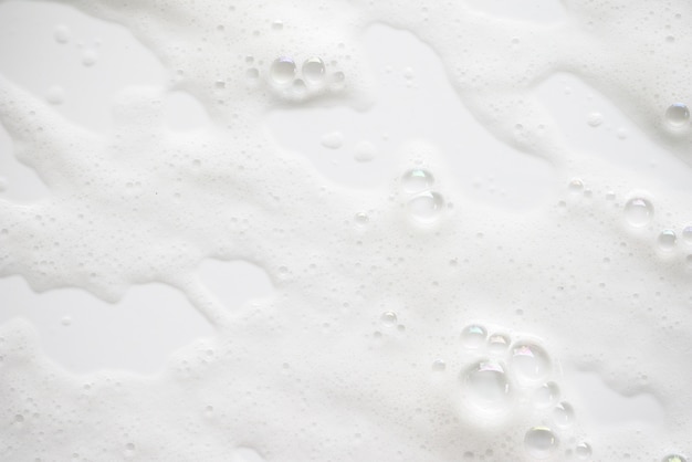抽象的な背景の白いせっけんの泡テクスチャ 泡付きシャンプーフォーム プレミアム写真