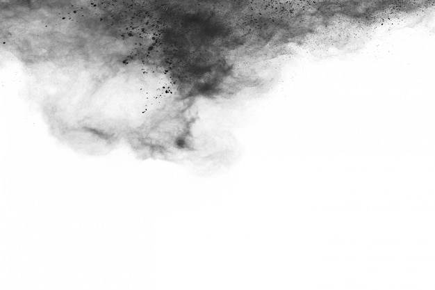 Premium Photo | Abstract black powder splatted on white background.