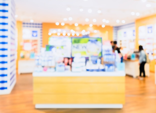 Abstract blurred photo of cosmetic shop counter with bokeh for background Premium Photo