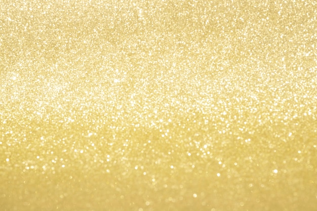 Abstract gold glitter bokeh lights with soft light background. Photo