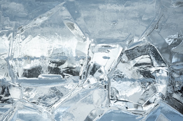 抽象的な氷の背景 氷の表面に亀裂のある青い背景 氷の背景のテクスチャ プレミアム写真