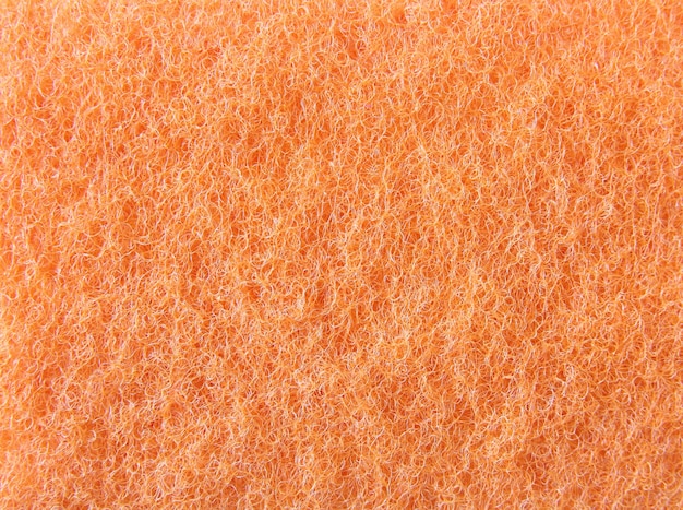 背景のための抽象的なオレンジ色のスポンジテクスチャ 無料の写真