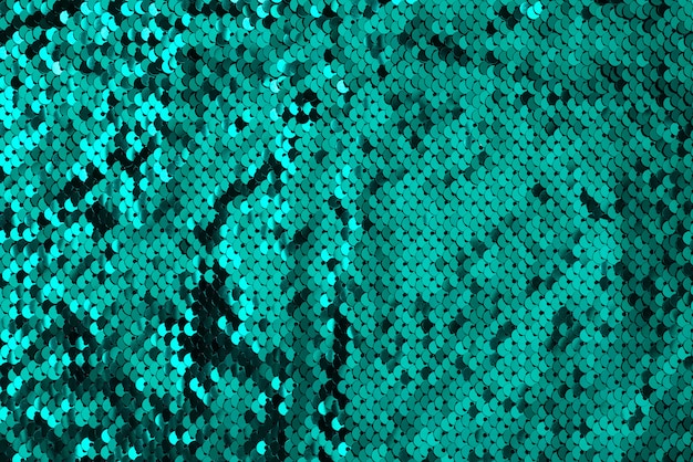 抽象的なスパンコールグリーンキラキラ波テクスチャ プレミアム写真