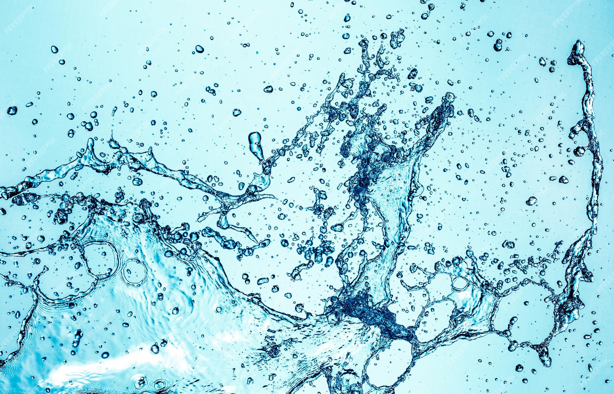 Premium Photo | Abstract water splash on blue background.