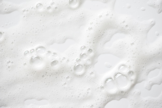 抽象的な白い石鹸の泡のテクスチャです 泡付きシャンプーフォーム プレミアム写真