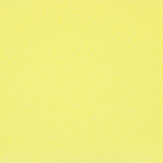 背景のための抽象的な黄色のスポンジテクスチャ 無料の写真