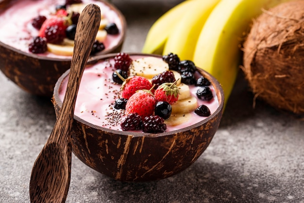 Premium Photo | Acai bowl in coconut plate.