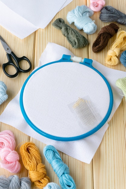 Premium Photo | Accessories for embroidery. hoop, floss threads ...