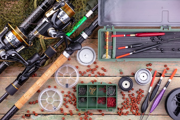 Premium Photo | Accessories for fishing on a wooden background