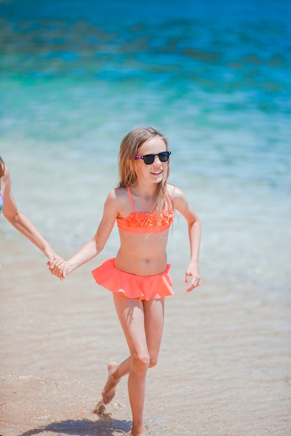 Premium Photo Active Little Girl At Beach Having A Lot Of Fun On The Seashore