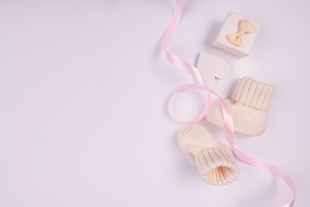 Adorable baby socks with copy space Free Photo