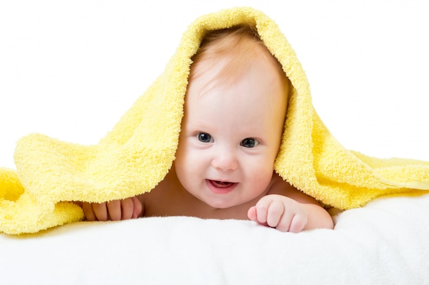 Adorable happy baby in towel Premium Photo