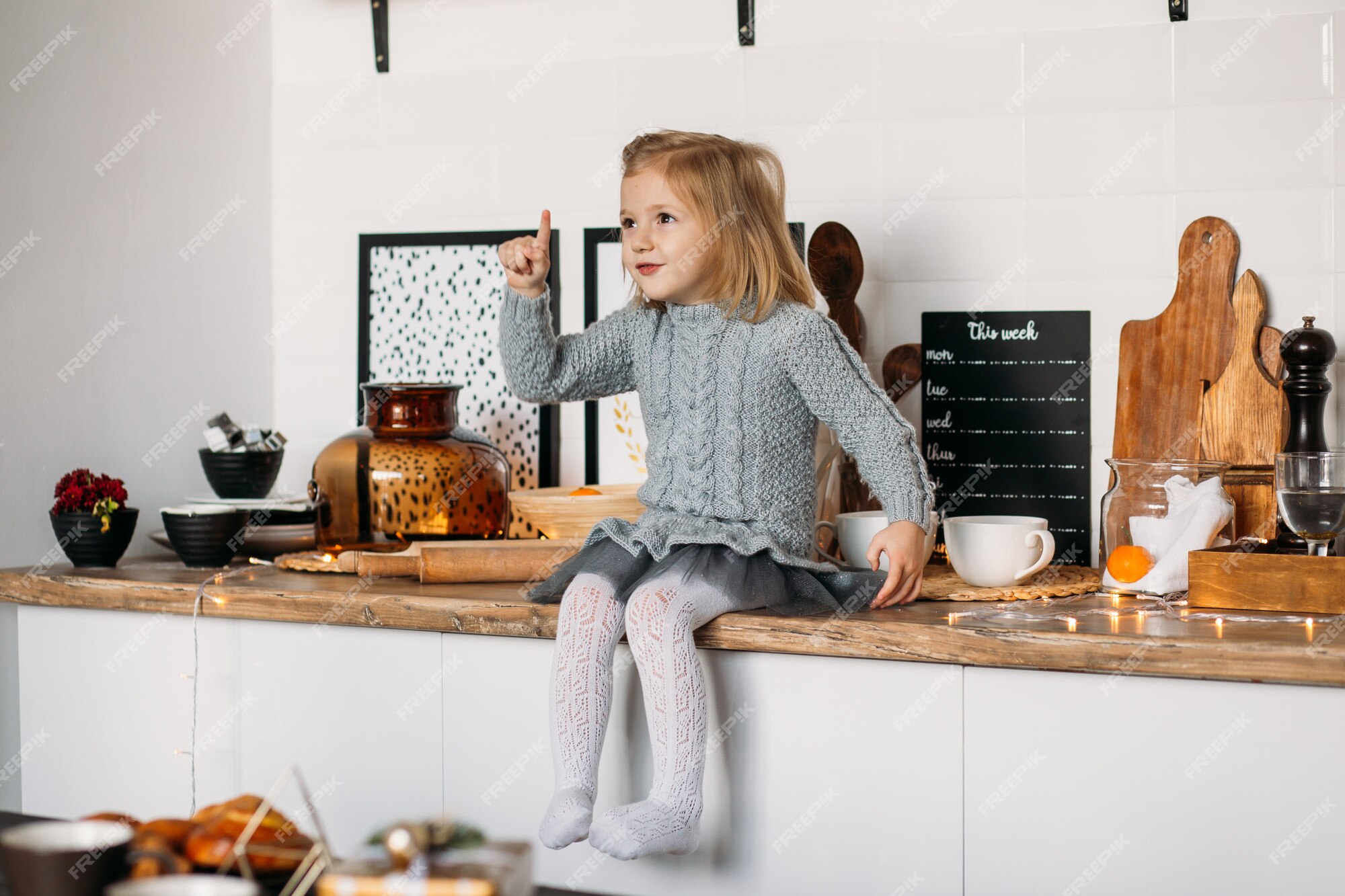 little girl at a kitchen table