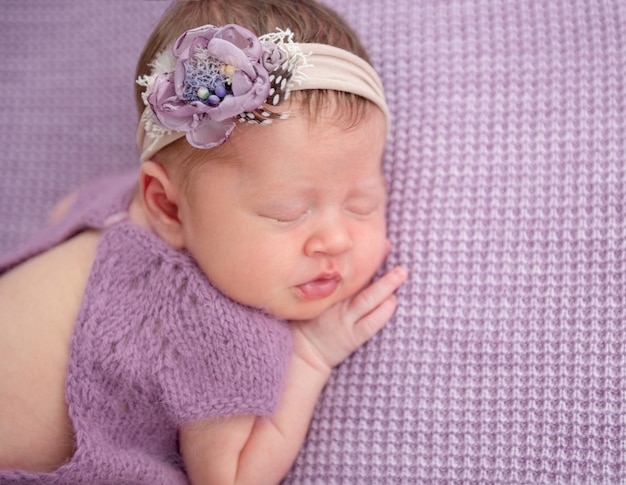 Premium Photo | Adorable newborn in knitted suit