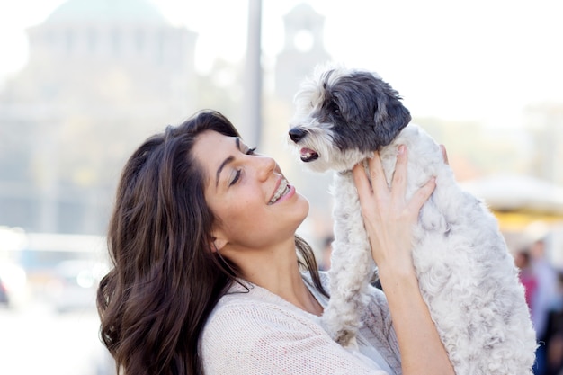 Adorable young woman with her pet Photo | Free Download