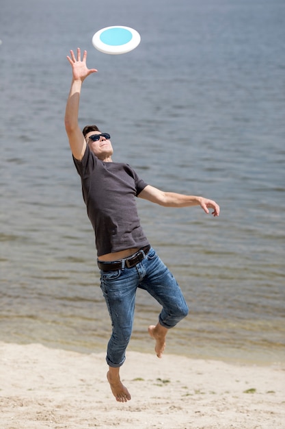 Free Photo Adult Man Catching Frisbee On Beach 4493