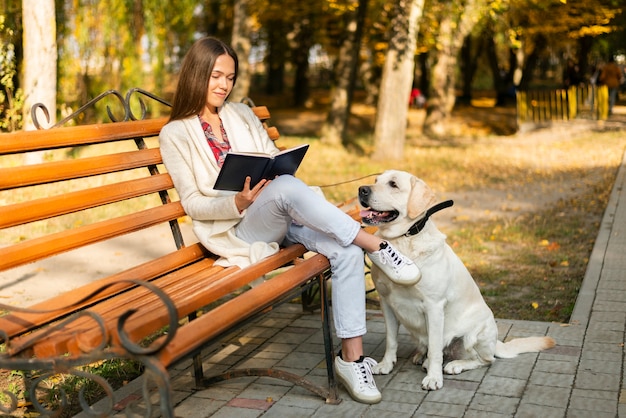 Adult woman sitting on a bench Free Photo