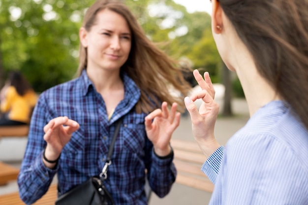 Free Photo | Adult women communicating through sign language