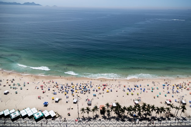 Aerial shot of copacabana beach in rio de janeiro brazil crowded with people Free Photo