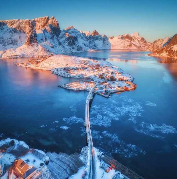 Premium Photo Aerial View Of Bridge Over The Sea And Snowy Mountains