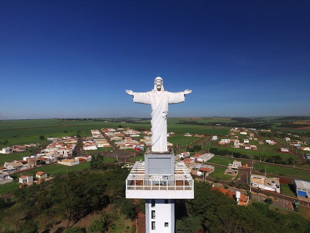 Aerial view of christ the redeemer in the city of sertaozinho, sao paulo, brazil. Premium Photo