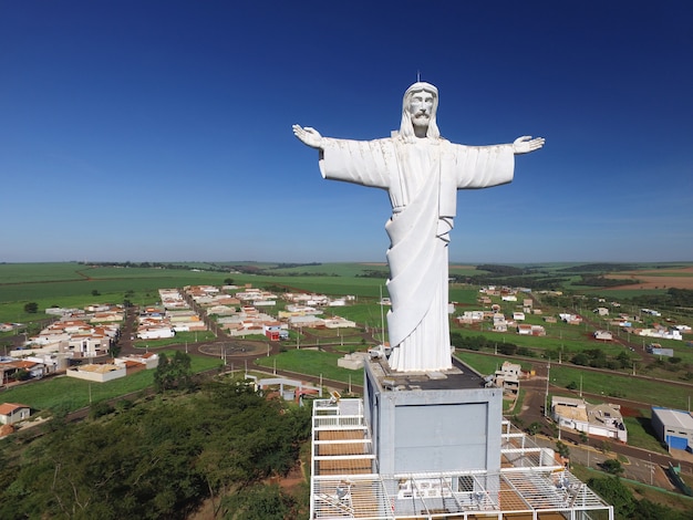 Aerial view of christ the redeemer in the city of sertaozinho, sao paulo, brazil. Premium Photo