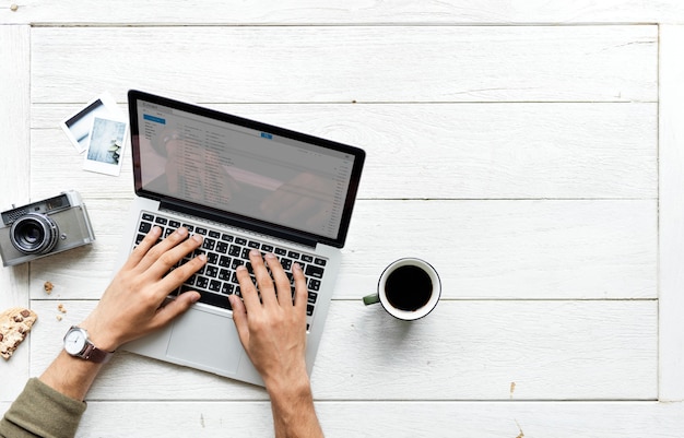 Aerial view of computer laptop on wooden table photography hobby concept Free Photo