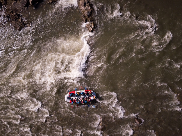 Premium Photo | Aerial view of people having fun during rafting in the ...