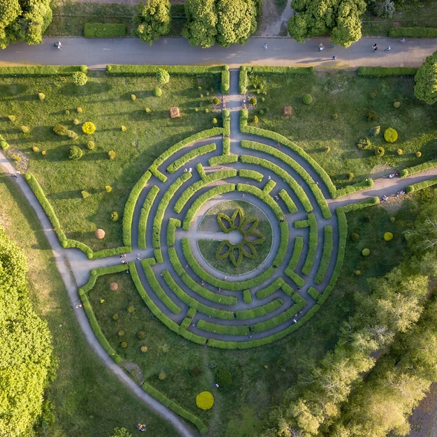 Premium Photo Aerial View Round Natural Labyrinth In The Spring Garden