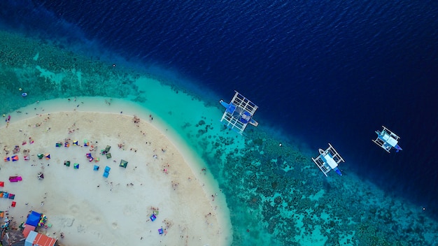 Free Photo | Aerial view of sandy beach with tourists swimming in ...