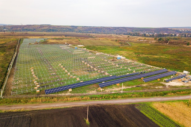 Premium Photo | Aerial view of solar power plant under construction on ...