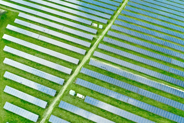 Premium Photo | Aerial view of solar power station in the green field ...