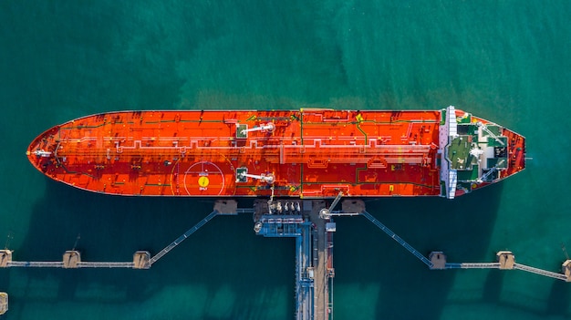 Aerial view tanker ship unloading at port, business import export oil with tanker ship transportatio
