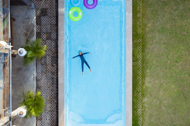 Premium Photo | Aerial view or top view of child is swimming in the ...