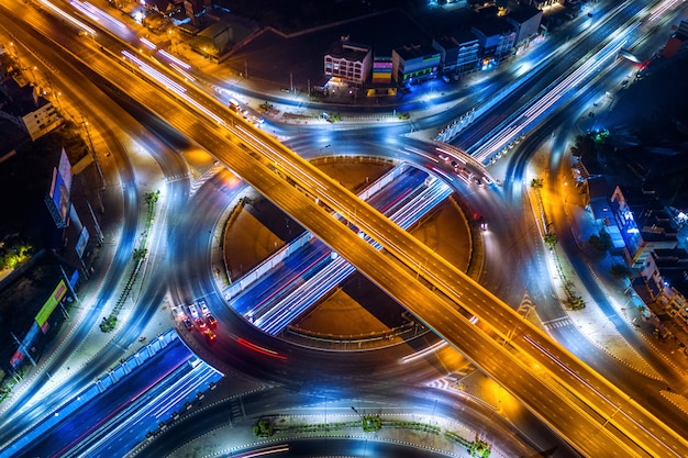 Aerial view of traffic in roundabout and highway at night. Free Photo