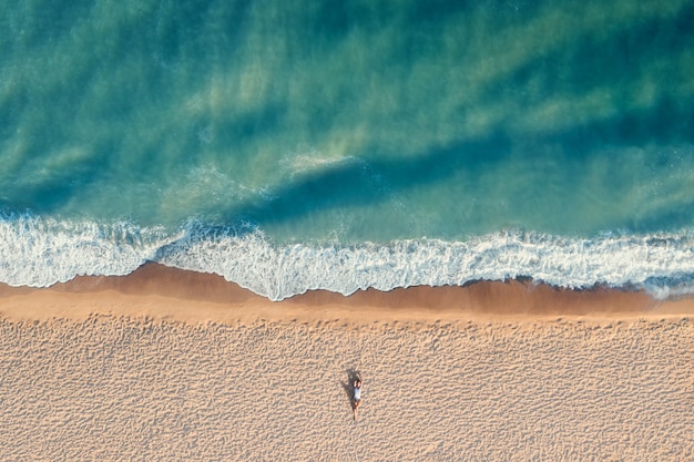 Premium Photo | Aerial view of young woman with beautiful body lies ...