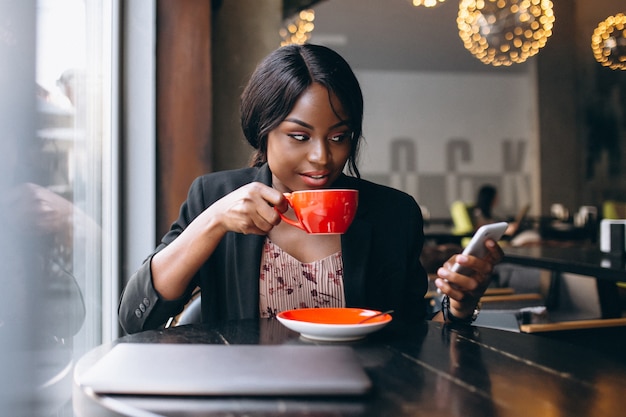 Free Photo | African american business woman working in a cafe