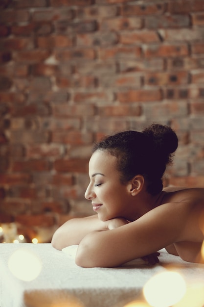 Free Photo African American Woman Receiving A Relaxing Massage At The Spa