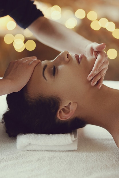 Free Photo African American Woman Receiving A Relaxing Massage At The Spa