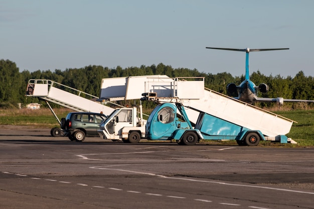 Premium Photo | Aircraft boarding ramps at the airport apron