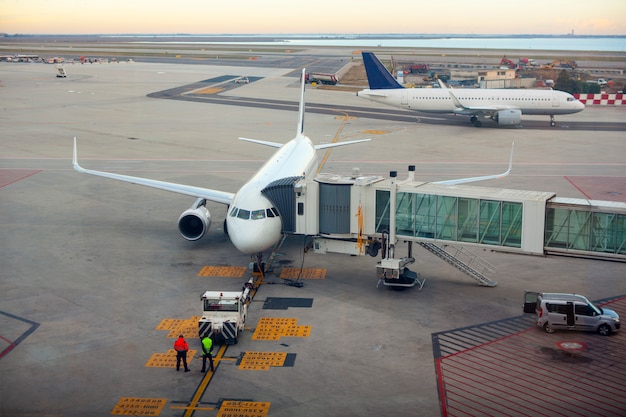 Premium Photo | Airplane at the terminal gate