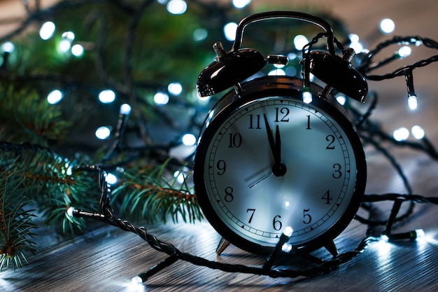 Premium Photo | Alarm clock and christmas lights
