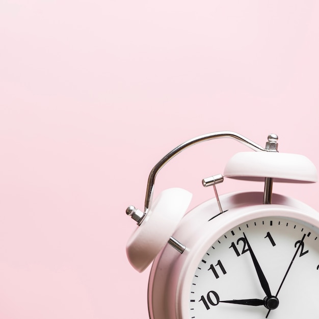 Free Photo Alarm Clock Showing The Time 10 O Clock Against Pink Background