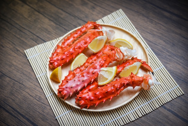 Premium Photo Alaskan King Crab Legs Cooked Seafood With Lemon Spices On Wood Plate In The Table Red Crab Hokkaido