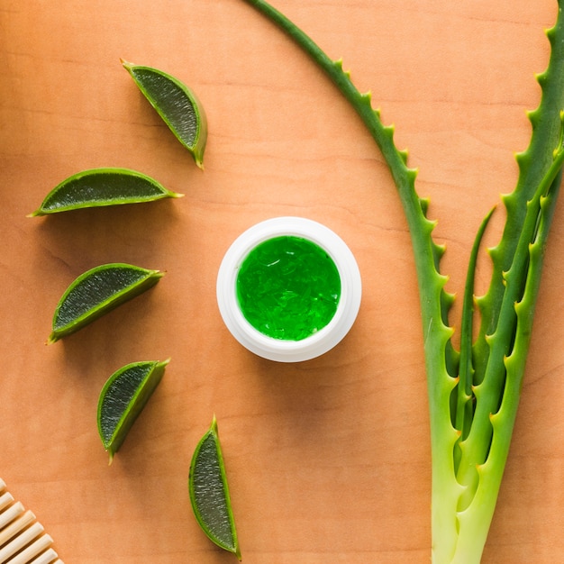 Aloe vera leaves with a beauty cream bottle Photo | Free Download