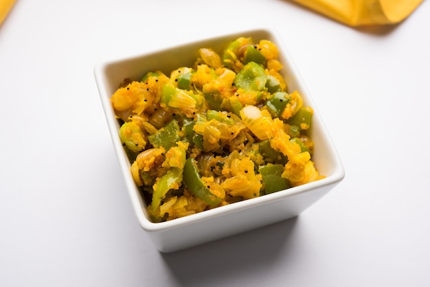 Premium Photo | Aloo capsicum sabzi or potato and bell pepper sabji is ...