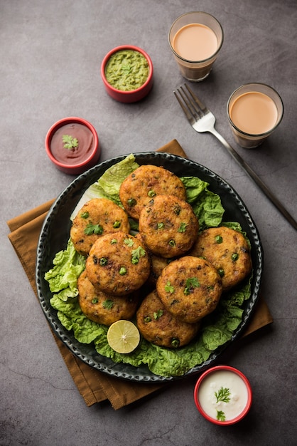 Premium Photo | Aloo tikki or potato cutlet or patties is a popular ...