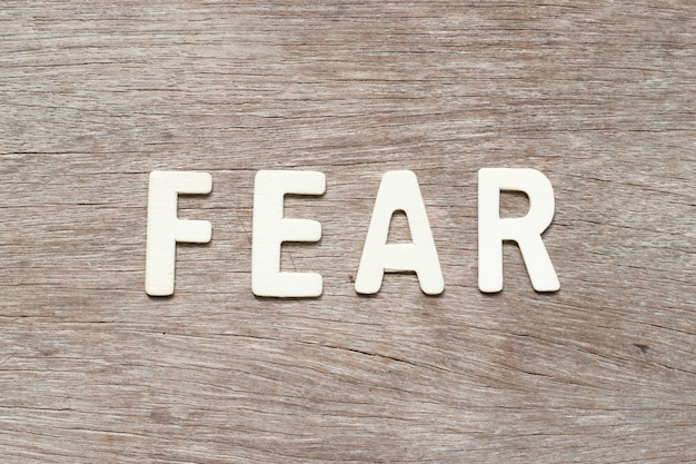 premium-photo-alphabet-letter-in-word-fear-on-wood-background