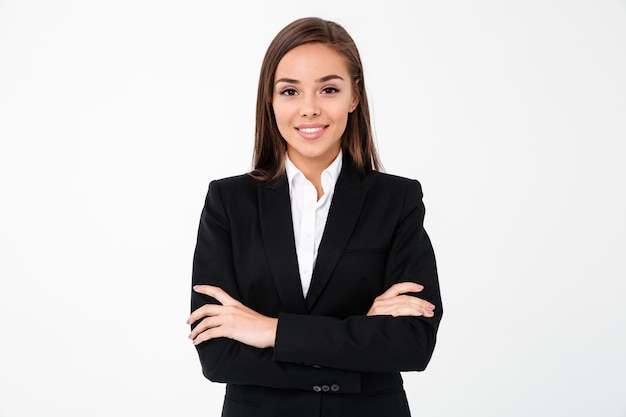 Amazing cheerful business woman standing with arms crossed | Free Photo