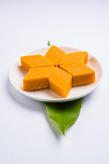 Premium Photo | Ambyachi vadi or mango burfi or barfi or cake from ...